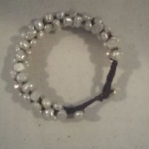 Bracelet hand made fresh water pearls and Leather.